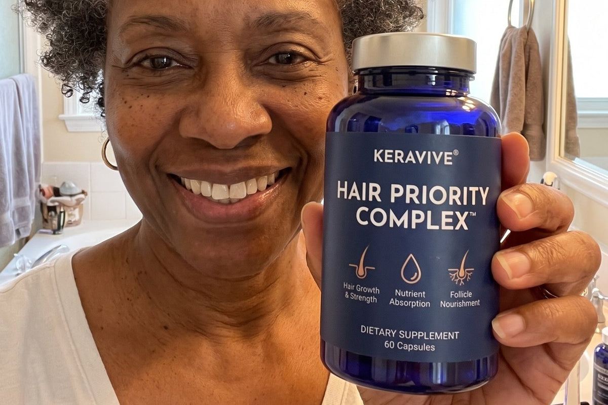 A real customer holding the Hair Priority Complex bottle